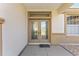 Detailed view of the double front doors with decorative glass and a welcoming entryway at 12511 Se 91St Terrace Rd, Summerfield, FL 34491