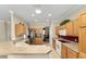 Spacious kitchen featuring wood cabinets, stainless steel appliances, and open layout at 12511 Se 91St Terrace Rd, Summerfield, FL 34491