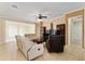 Bright and airy living room with large windows, offering plenty of natural light at 12511 Se 91St Terrace Rd, Summerfield, FL 34491