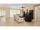 Bright and airy living room with large windows, offering plenty of natural light at 12511 Se 91St Terrace Rd, Summerfield, FL 34491
