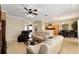 Open-concept living room flowing into the dining area and kitchen with ample seating at 12511 Se 91St Terrace Rd, Summerfield, FL 34491