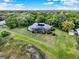 An aerial view of the property showcasing the beautiful home and the lush surrounding landscape at 13112 Luntz Point Ln, Windermere, FL 34786