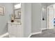 Bathroom view showcasing a vanity, decor and transition to carpeted hallway at 13112 Luntz Point Ln, Windermere, FL 34786