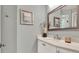 Well-lit bathroom features a vessel sink, framed mirror, and elegant decor at 13112 Luntz Point Ln, Windermere, FL 34786