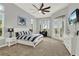 Spacious bedroom with bright natural light, ensuite bath, and private outdoor terrace at 13112 Luntz Point Ln, Windermere, FL 34786