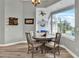 Breakfast nook features a round table, seating for four, with pool and backyard views at 13112 Luntz Point Ln, Windermere, FL 34786