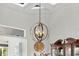 Elegant dining room features a decorative chandelier, complemented by a clock and fine wood furniture at 13112 Luntz Point Ln, Windermere, FL 34786