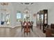 Spacious formal dining room with ample natural light, decorative lighting, and a view of the outdoor patio at 13112 Luntz Point Ln, Windermere, FL 34786
