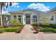 A beautiful home featuring an inviting entry and manicured landscaping at 13112 Luntz Point Ln, Windermere, FL 34786