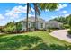 Beautifully landscaped front yard leading to an elegant single Gathering home at 13112 Luntz Point Ln, Windermere, FL 34786