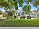 Landscaped front exterior with a well-manicured lawn and inviting curb appeal at 13112 Luntz Point Ln, Windermere, FL 34786