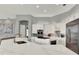 Gourmet kitchen with white cabinetry, quartz countertops, and stainless steel appliances at 13112 Luntz Point Ln, Windermere, FL 34786