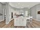 Spacious kitchen featuring white cabinets, quartz countertops, and stainless steel appliances at 13112 Luntz Point Ln, Windermere, FL 34786