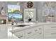 Modern kitchen featuring quartz countertops, stainless steel appliances, and an undermount sink at 13112 Luntz Point Ln, Windermere, FL 34786