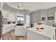 Bright kitchen featuring white cabinets, stainless steel appliances, and spacious countertops with wood flooring at 13112 Luntz Point Ln, Windermere, FL 34786