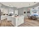Bright kitchen with white cabinets, stainless appliances, double islands, and a dining nook at 13112 Luntz Point Ln, Windermere, FL 34786