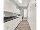 Spacious laundry room boasts ample storage, sleek countertops, and modern appliances at 13112 Luntz Point Ln, Windermere, FL 34786