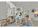 Bright, open living area showcasing neutral decor, elegant columns, and view towards a patio with lots of natural light at 13112 Luntz Point Ln, Windermere, FL 34786