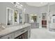 Spa bathroom showcasing a modern vanity, sleek fixtures, and a luxurious glass-enclosed shower at 13112 Luntz Point Ln, Windermere, FL 34786