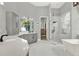 Large bathroom features dual vanities, a glass shower, and stylish fixtures at 13112 Luntz Point Ln, Windermere, FL 34786