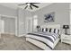 Calm bedroom features neutral colors, soft carpet, and minimalist decor at 13112 Luntz Point Ln, Windermere, FL 34786