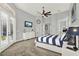 Generous bedroom features French doors, a large dresser, and views of the outdoor pool at 13112 Luntz Point Ln, Windermere, FL 34786