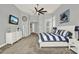Spacious bedroom showcasing vaulted ceilings, neutral tones, and contemporary furnishings at 13112 Luntz Point Ln, Windermere, FL 34786