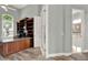Bright office space with custom built-ins and entry to a bathroom at 13112 Luntz Point Ln, Windermere, FL 34786