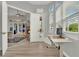 Open-concept view from the office showcasing the fireplace, living room and pool area at 13112 Luntz Point Ln, Windermere, FL 34786