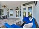 Outdoor patio featuring a seating area, ceiling fan, and tiled flooring at 13112 Luntz Point Ln, Windermere, FL 34786