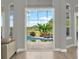 View of backyard pool from the home's living area, filled with natural light at 13112 Luntz Point Ln, Windermere, FL 34786