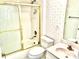 Well-maintained bathroom features a shower-tub combination, toilet, and sink with vanity at 1312 Corona Ave, The Villages, FL 32159