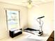 Bright bedroom with ceiling fan and window providing natural light, perfect for a home gym at 1312 Corona Ave, The Villages, FL 32159