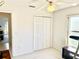 View of second bedroom with closet and ceiling fan at 1312 Corona Ave, The Villages, FL 32159