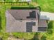 Top-down aerial shot highlighting solar panels and a new roof at 137 E Palmetto Ave, Howey In The Hills, FL 34737