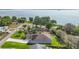 Aerial view showcases the home's solar panels and beautiful location near the lake at 137 E Palmetto Ave, Howey In The Hills, FL 34737