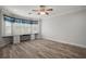 Bright bedroom featuring built-in desk, ceiling fan, and an abundance of natural light at 137 E Palmetto Ave, Howey In The Hills, FL 34737