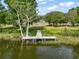Waterfront view of a wooden dock extending into the lake at 137 E Palmetto Ave, Howey In The Hills, FL 34737