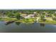 Picturesque lake view with docks and a boat ramp at 137 E Palmetto Ave, Howey In The Hills, FL 34737