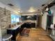 Functional kitchen boasts modern appliances, ample counter space, and stylish wood-look flooring at 1425 Douglas Rd, Groveland, FL 34736