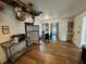 Eat-in kitchen with a stainless steel refrigerator, dining area, and hardwood floors, combining functionality and style at 1425 Douglas Rd, Groveland, FL 34736