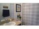 Charming bathroom decorated with beach-themed decor at 146 Essex Pl, Davenport, FL 33896