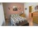 Cozy bedroom features unique decorations, a comfortable bed, and neutral tones at 146 Essex Pl, Davenport, FL 33896