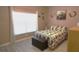 Cozy bedroom with a window, decorative touches, and a comfortable-looking bed at 146 Essex Pl, Davenport, FL 33896