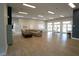 A view of the clubhouse featuring a large sitting area, several windows, and a table set perfect for a small gathering at 146 Essex Pl, Davenport, FL 33896