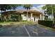 Community clubhouse with well-maintained landscaping and parking offers residents a social and recreational hub at 146 Essex Pl, Davenport, FL 33896