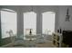 Bright dining area featuring a round glass table and three-pane window at 146 Essex Pl, Davenport, FL 33896