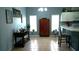 Bright dining room featuring tile flooring, gray walls, and an antique display cabinet at 146 Essex Pl, Davenport, FL 33896