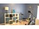 Bright exercise room featuring a modern stationary bike and organization shelves at 146 Essex Pl, Davenport, FL 33896