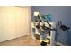 Exercise room with stationary bike and ample storage closet at 146 Essex Pl, Davenport, FL 33896